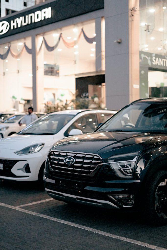 Hyunday, motorm photo of new cars parked in front of a car dealership